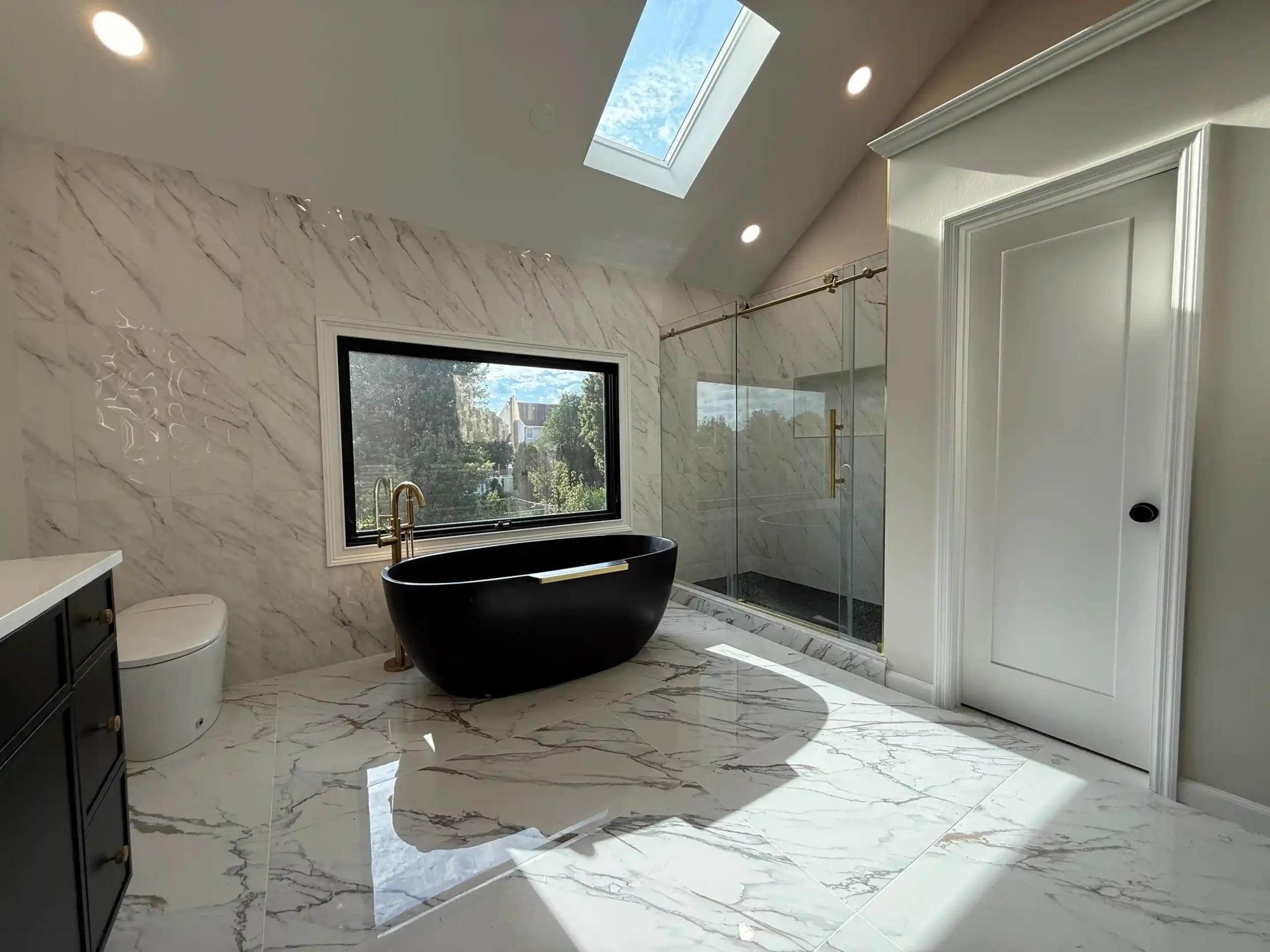 Modern bathroom remodel with walk-in shower by Gold Standard Bathrooms