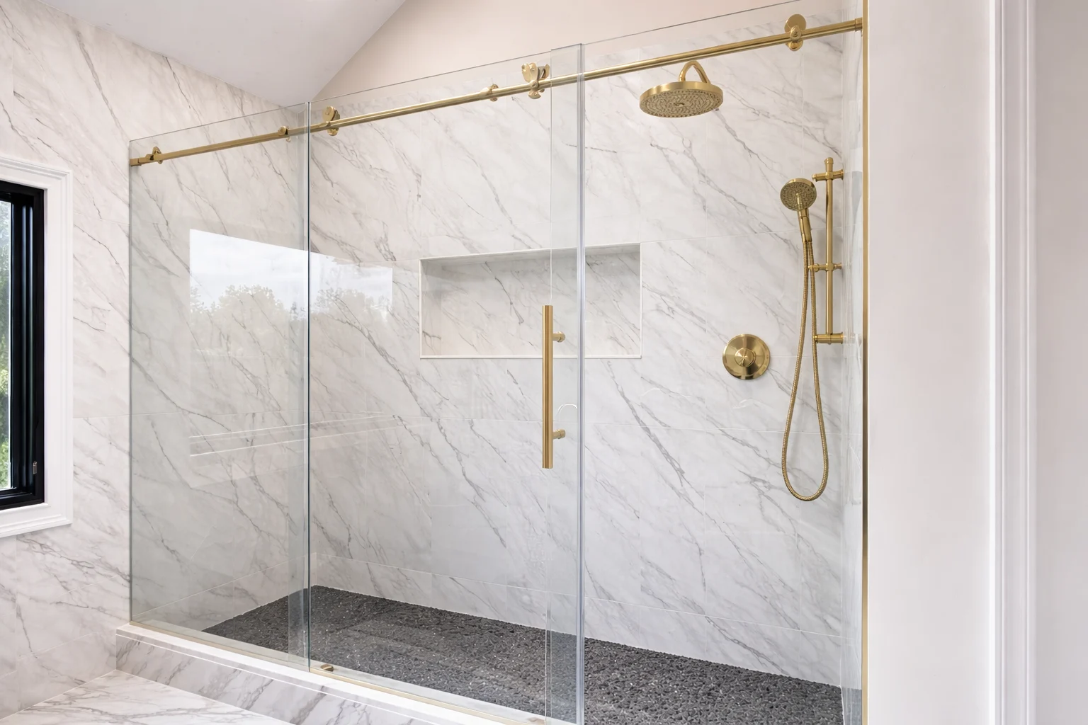Glass walk-in shower with gold fixtures in a South Brunswick NJ bathroom remodel