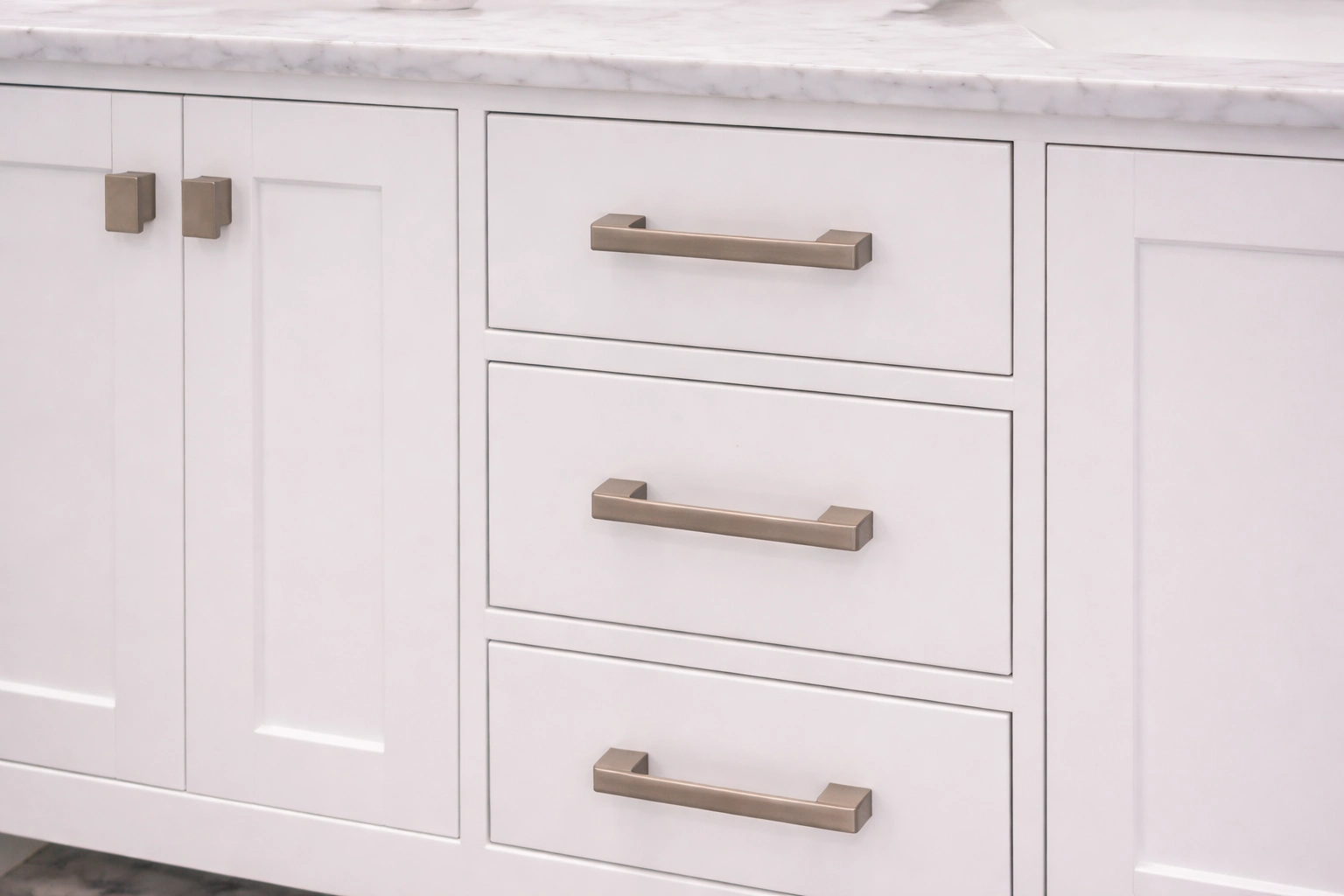 White shaker-style vanity cabinets with brushed nickel hardware in a bathroom remodeler project in Manalapan Township, NJ.