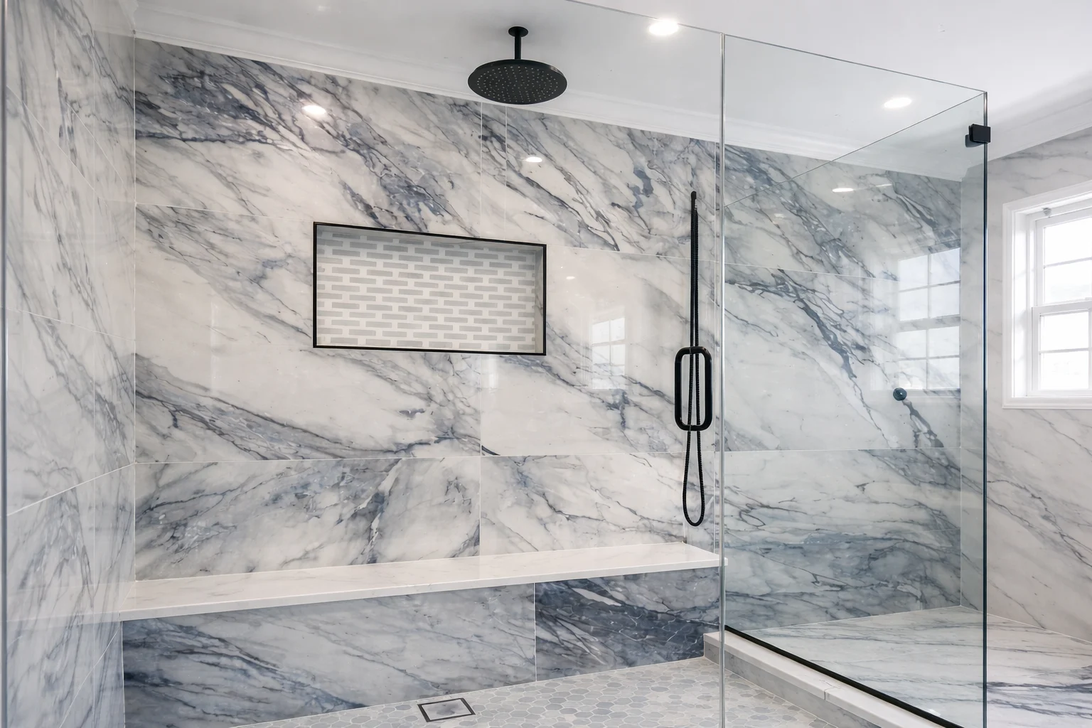 Large walk-in shower with built-in bench in a Marlboro NJ bathroom remodel