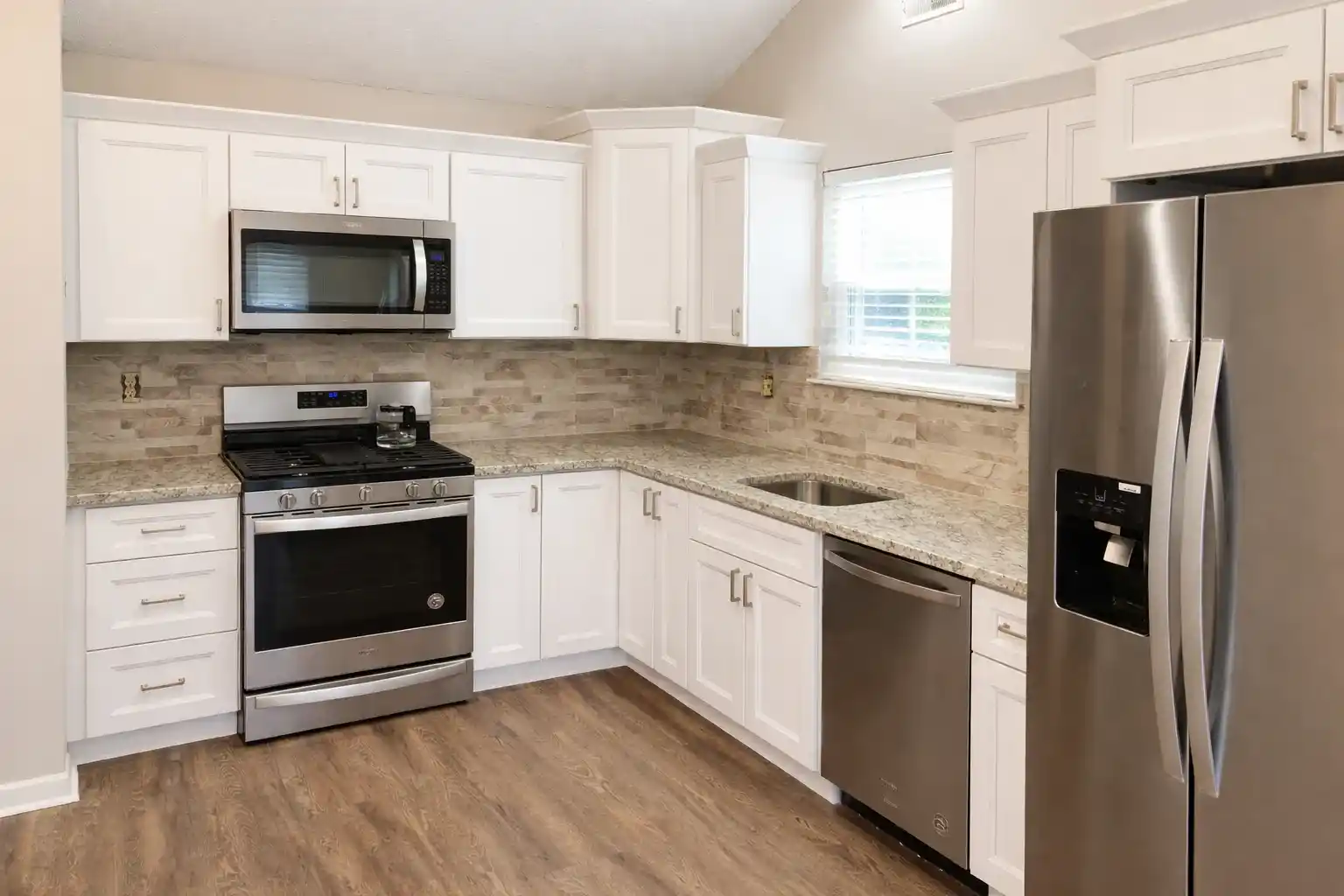 White shaker cabinets and stainless appliances in a Neptune City NJ kitchen remodel