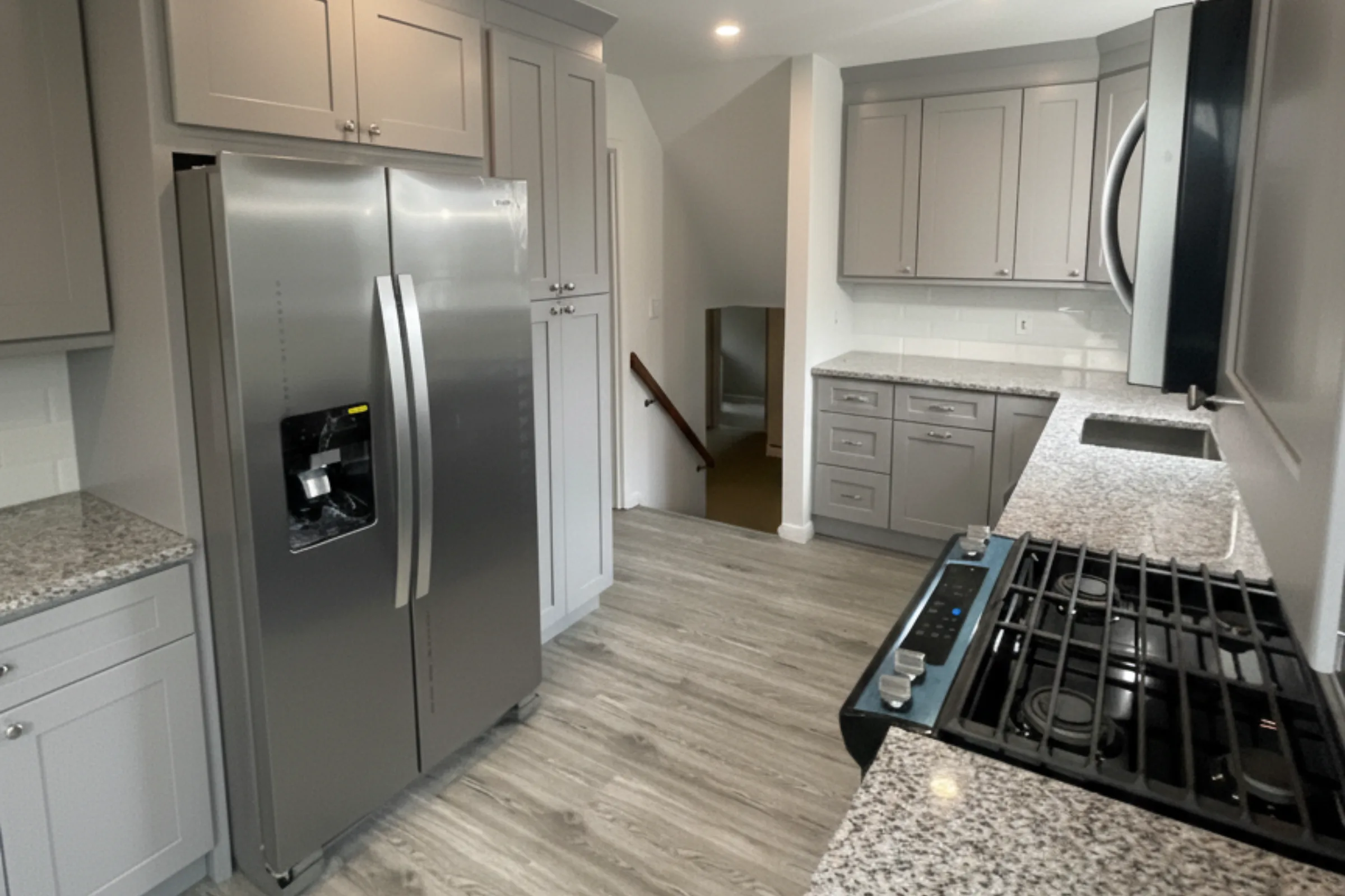 Modern gray kitchen remodel in Matawan NJ by Gold Standard Bathrooms
