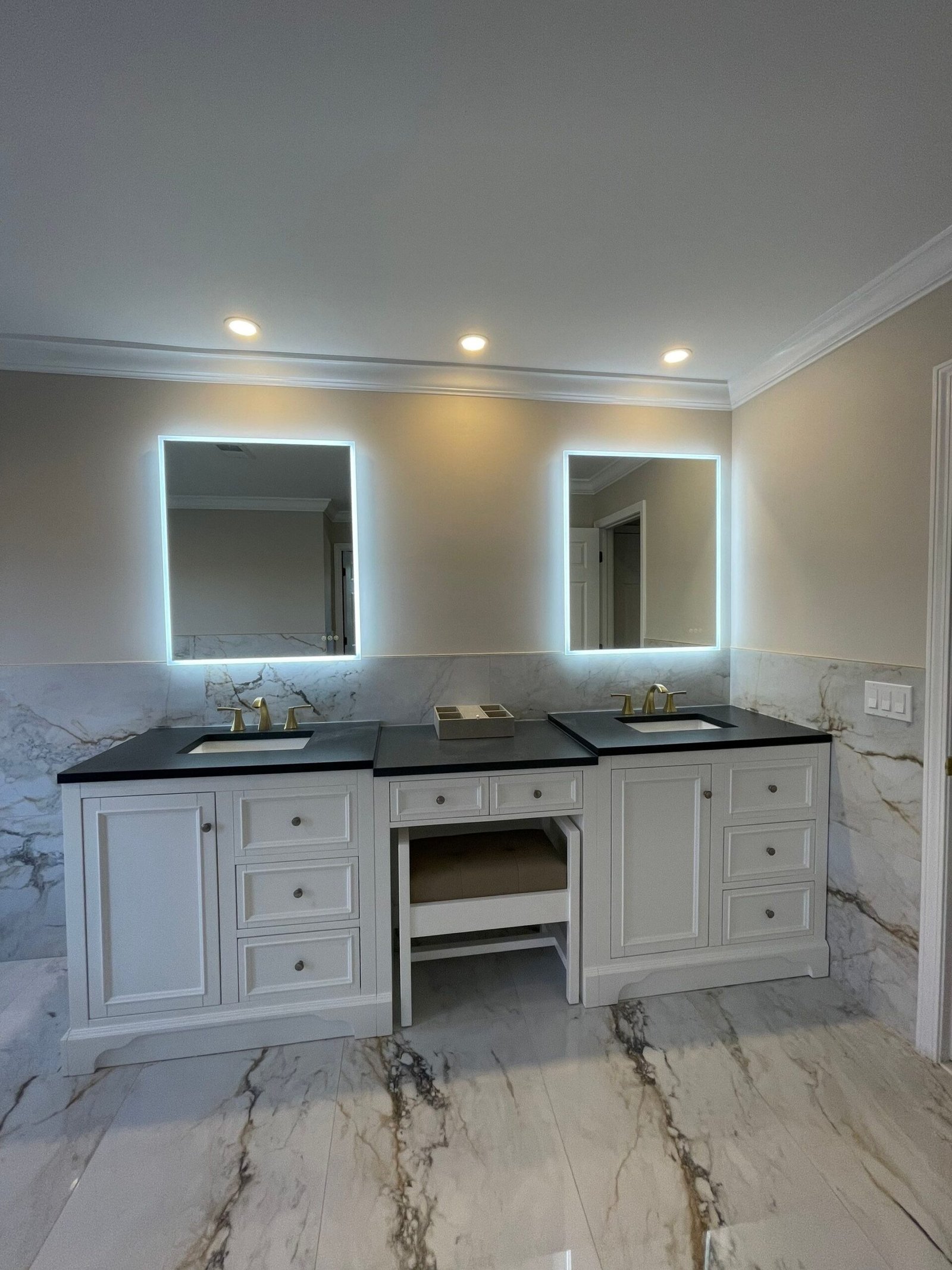 Completed bathroom remodel with modern finishes by Gold Standard Bathrooms