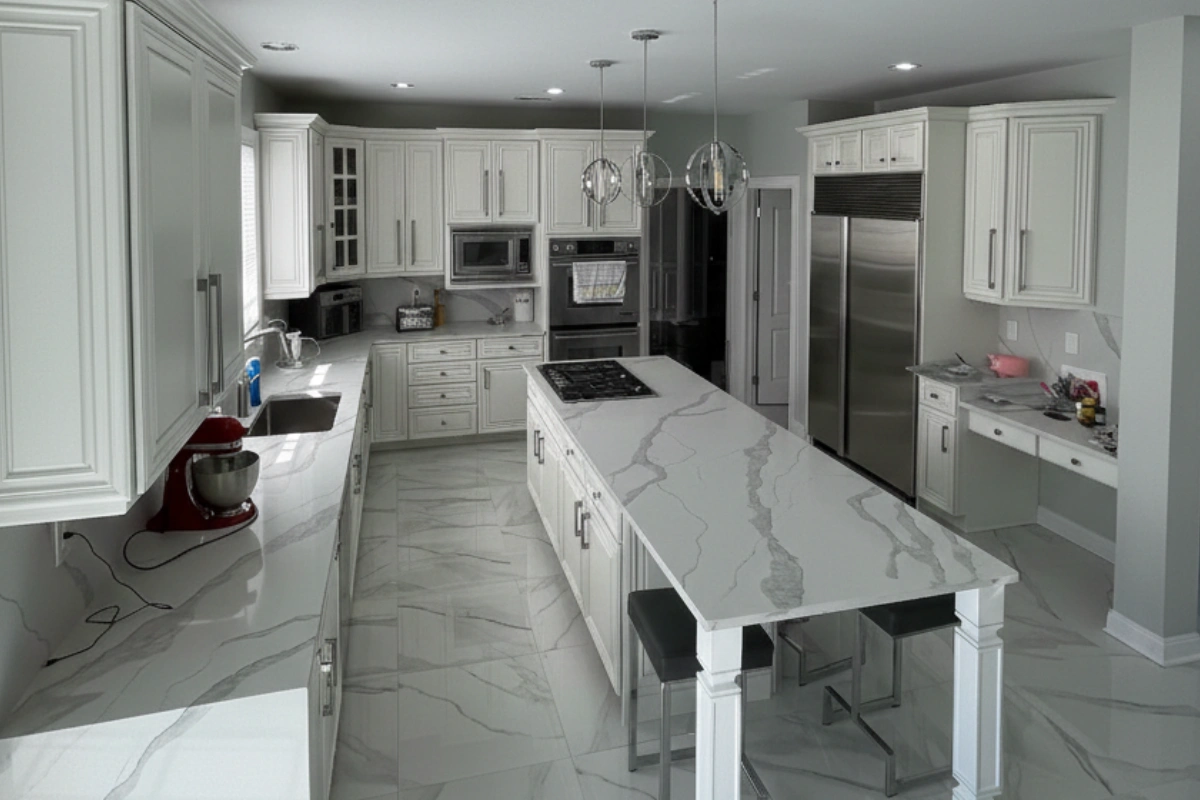 White quartz island in a Matawan NJ kitchen remodel by Gold Standard Bathrooms