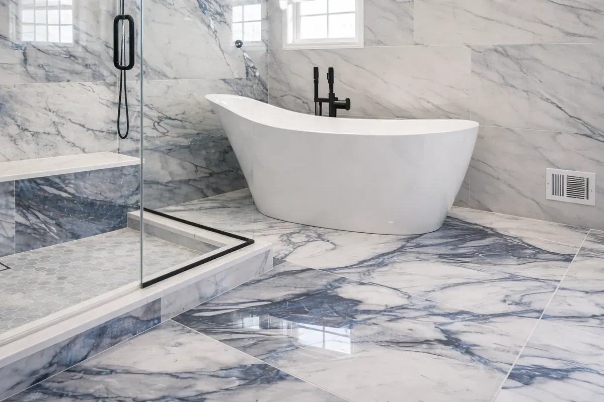 Freestanding bathtub with glass shower enclosure by Gold Standard Bathrooms in Neptune City NJ